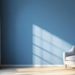 Living room with deep blue walls, cozy seating, and soft lighting, creating a warm and inviting atmosphere.